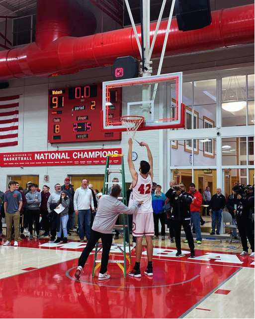 PresidentFeller's tweet photo. Great victory for @WabashBBall on Saturday to earn the regular season @NCAC  conference championship. Amazing to see Noah cut down the set WITHOUT a ladder. Priceless to see the expression on my grandson's face when Noah gave him a piece of the net! https://t.co/qKhjr7gq0P