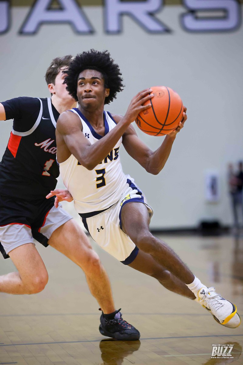 McKinney High's Quintel Wilson (3) drives past Flower Mound Marcus' Dominick Harris (1) in a 6A Region 1 Bi-District playoff game at The Colony High School on Monday, February 19, 2024. McKinney High won the game 64-56. (Kevin Bartram/buzzphotos.com) <a href="/McKISDAth/">McKinneyISD Ath Dept</a> <a href="/MHSLionsHoops/">MHS Lions Boys Basketball</a>