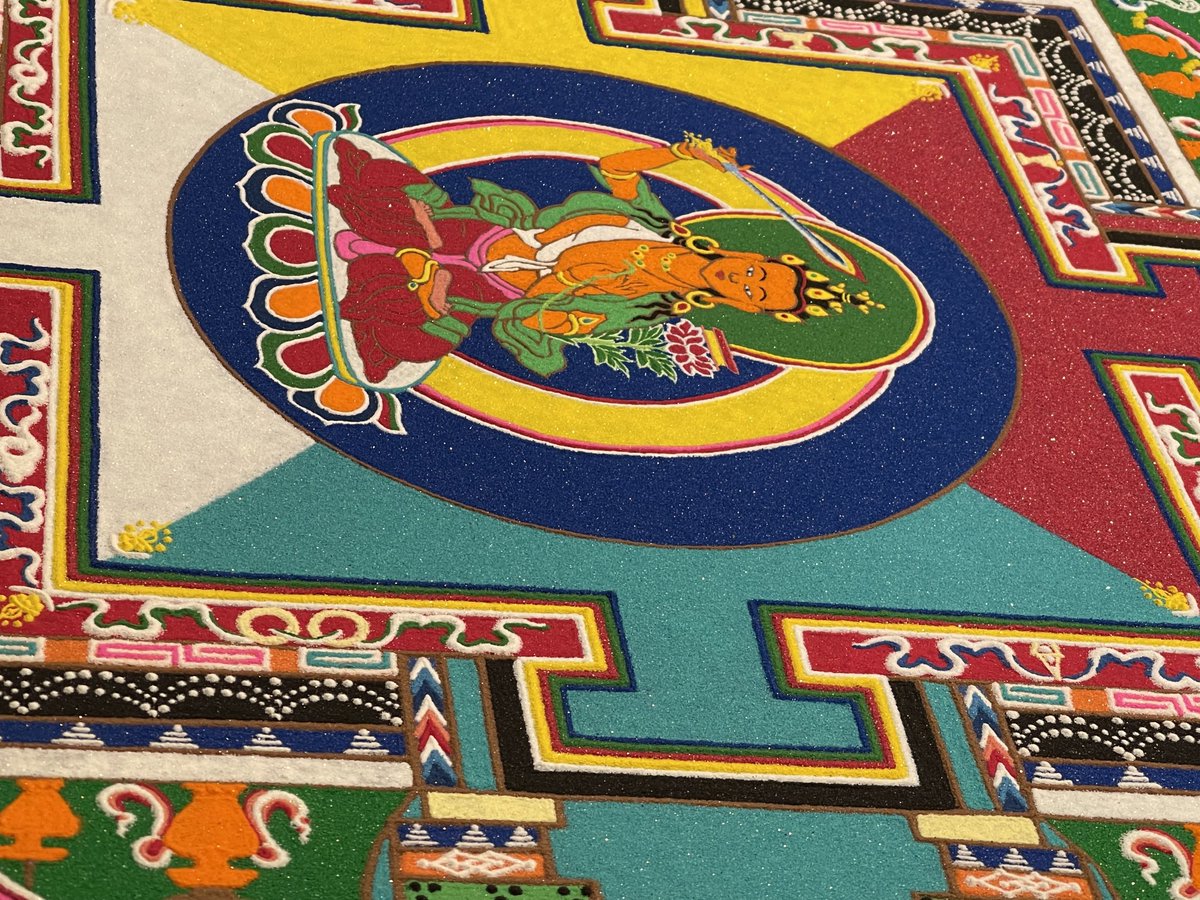 This is the beginning of a  colorful sacred sand   Mandala  being created. . Brilliant Geshes and Monks share their Buddhist culture, philosophy, empowerments , healings, blessings and wisdom. They will be in Auburn California for one more week and complete the Mandala.