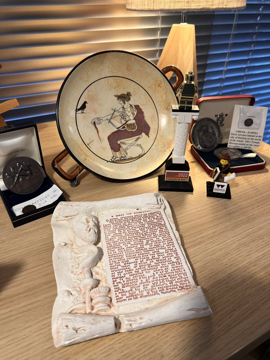 profmcscott's tweet photo. Happy #ILCD2024 #InternationalLegoClassicismDay 2024!  Here is my LEGO figure and Brick Classicist of the Year Award 2022 proudly on display alongside some other (replica) relics of the ancient world! And hats off to @UbisoftQuebec - host of #ILCD24 &amp; 2 founder @BrickClassicist https://t.co/jHuUE4i2Sh