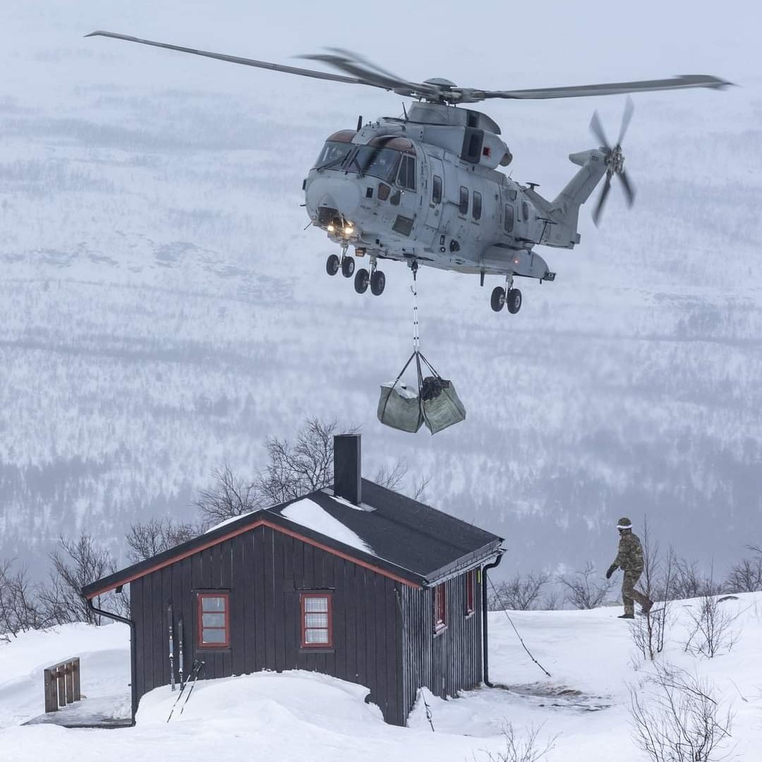 Commando Merlin helicopters have replenished log supplies to cabins in the Øvre Dividal National Park, Norway. These shelters serve hikers and others when the weather changes or as planned stops. This is now an annual Thank You gesture to our Norwegian hosts, for their support.