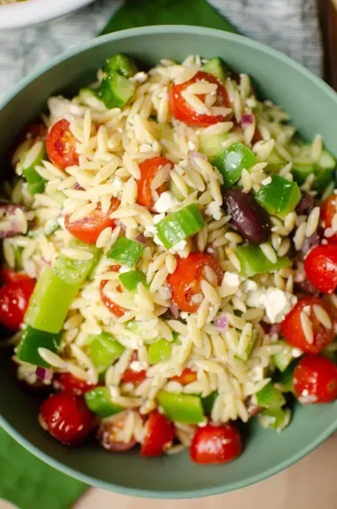 Living_Lou's tweet photo. Greek Orzo Salad is tossed with a homemade Greek dressing, fresh tomatoes, cucumbers, bell pepper, onions, olives and feta cheese. YUM! 📌

RECIPE: https://t.co/TILKISWXcY
#salad #veggies https://t.co/3CpQBa6ysq
