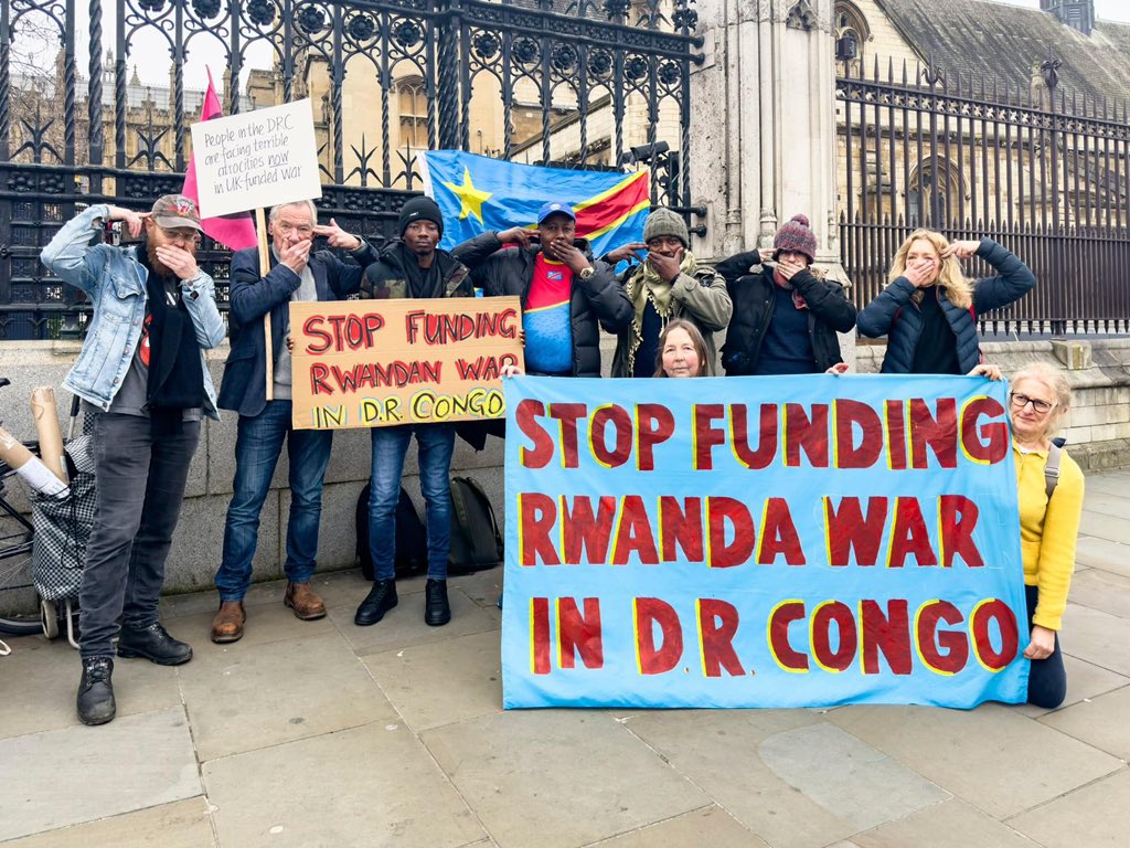 Joe__Bassey's tweet photo. STOP FUNDING RWANDA WAR IN D.R.CONGO

Extinction Rebellion's House of Commons protest reveals the UK government’s role in exploitation and violence around resources in Africa.

What are the dangerous and shadowy links between the UK Government’s Rwanda flights and a heartbreaking war over resources in Africa that is also fuelling the climate crisis and destroying vital ecosystems?

Extinction Rebellion activists answered that complex question as they staged a protest in the House of Commons pretending to hold guns to their heads and unfurling a banner saying: 'STOP FUNDING RWANDA WAR IN D.R. CONGO.'

The activists drew public attention to the causes and impacts of a conflict that has raged in the Democratic Republic of Congo (DRC) for over three decades between armed gangs and militias fighting for control of an estimated $24 trillion in natural resources.

Their actions served as a plea for the world to realise that Goma, one of the main cities in eastern DRC, is just days from being captured by a violent militia group.

 Vast caches of copper, diamonds, tantalum, tin, gold, and more than 63% of global cobalt production are the prize that the gangs use to get rich by selling them to the UK and other rich developed nations to produce mobile phones, computers, batteries and increasingly for renewable energy technologies.

The fighting has displaced more than 10 million people, triggered indiscriminate killings and mass rape, and seen militia armies ransack the country’s rainforests with illegal logging and poaching, damaging the wild places that absorb huge amounts of the carbon dioxide and slow down the climate and ecological emergency.

Dig a little deeper, say the activists, and you discover that one of the worst militias, the M23, committing murder and ecological destruction across huge areas of the DRC, is funded by the Rwandan government – who are in turn receiving funding from the UK government.

Copied 

#CongoGenocide  #CongoIsBleeding