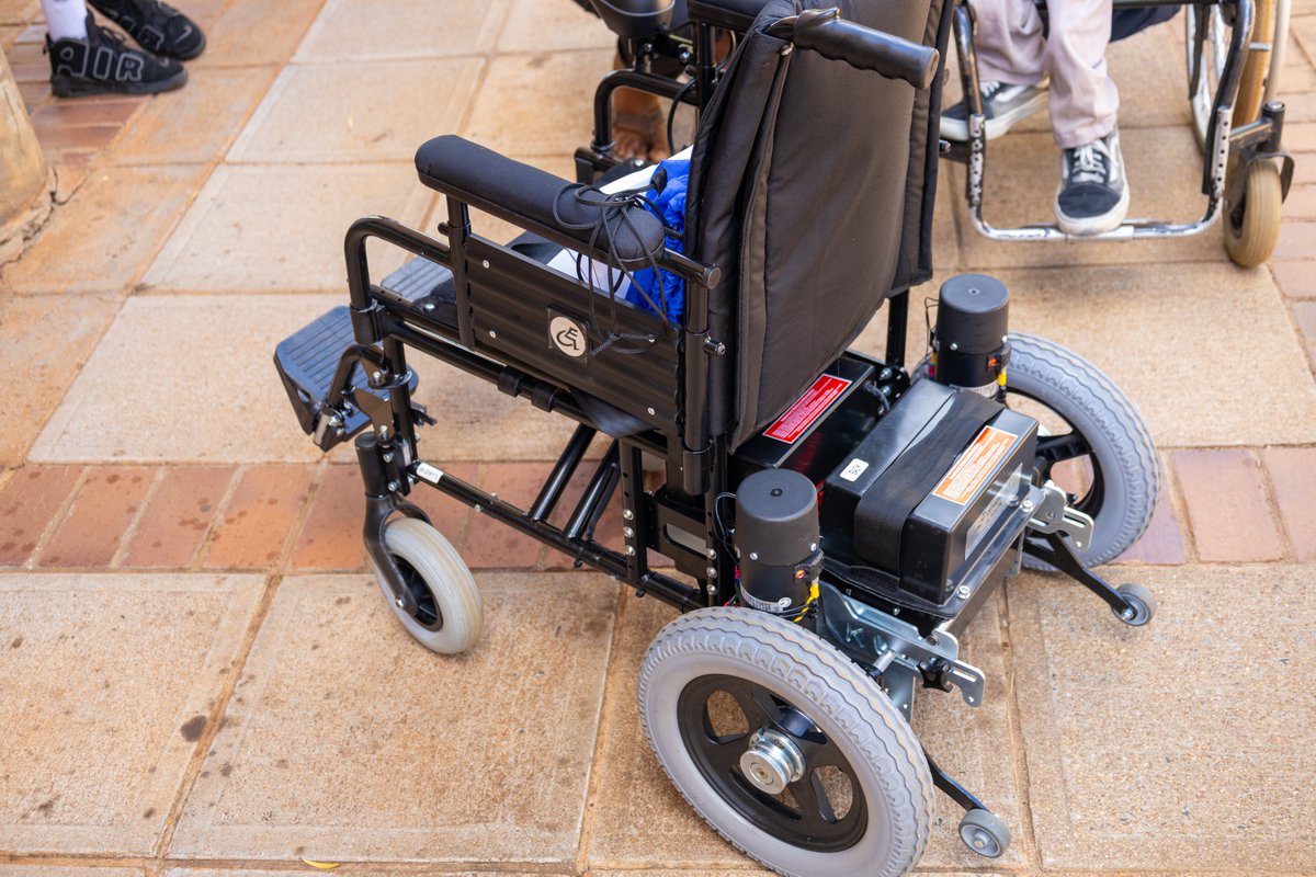 Africa_Univ's tweet photo. AU, led by the VC's, gifted Tatenda Mudengapfupfu, a first-year Psychology student, with a motorized wheelchair . A symbol of inclusivity and support, this gesture highlights AU's commitment to fostering a diverse and empowering campus community. #InclusiveEducation #Empowerment https://t.co/BkAI2vtjlc