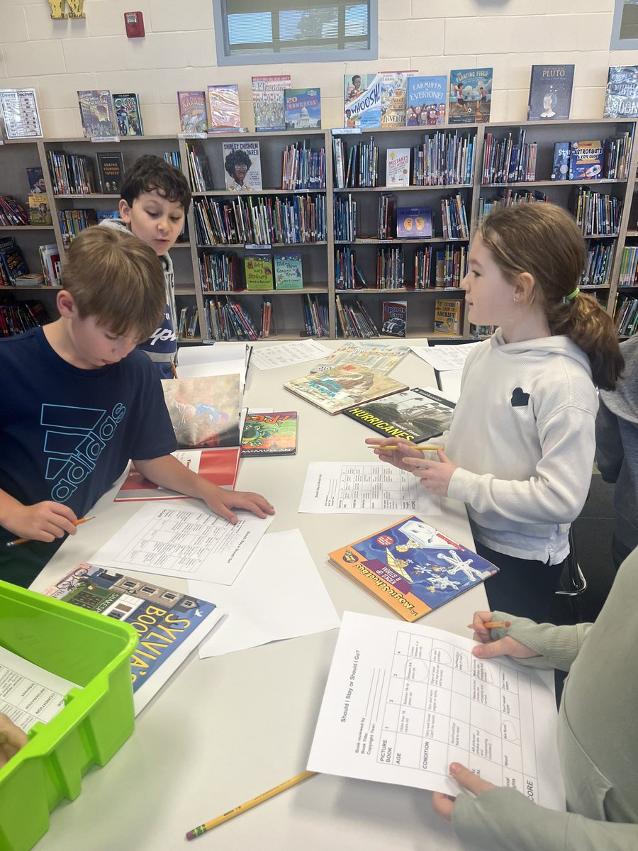 Librarians at work!  Learning about the weeding process and applying it to books using a rubric! <a href="/SHlightbulblab/">Margo Newtown</a> <a href="/LakeForestSD67/">Lake Forest School District 67</a>