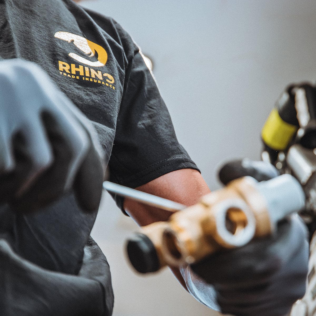 Plumbing game strong, and so is the fashion game. 💧🔧 @cputilitysolutions Let's see you rocking the Rhino swag on-site 🦏👀 #plumbing #tradeinsurance #tradeswear #onsite