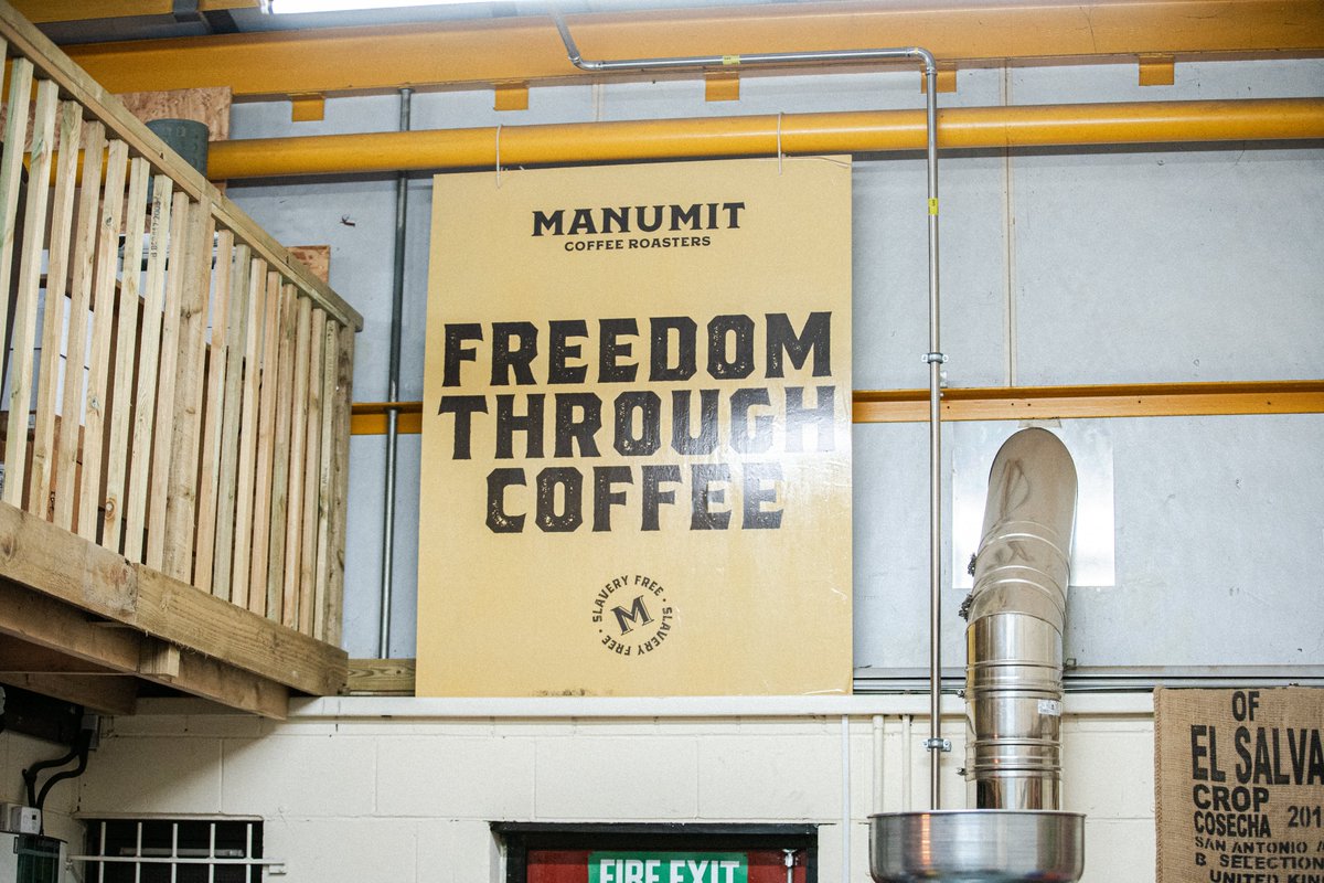 FREEDOM THROUGH COFFEE: These words are written large on the wall of the roastery, it's the first thing you see when you walk in! It's a reminder of why we do what we do - roasting coffee that helps rebuild the lives of survivors #FreedomThroughCoffee