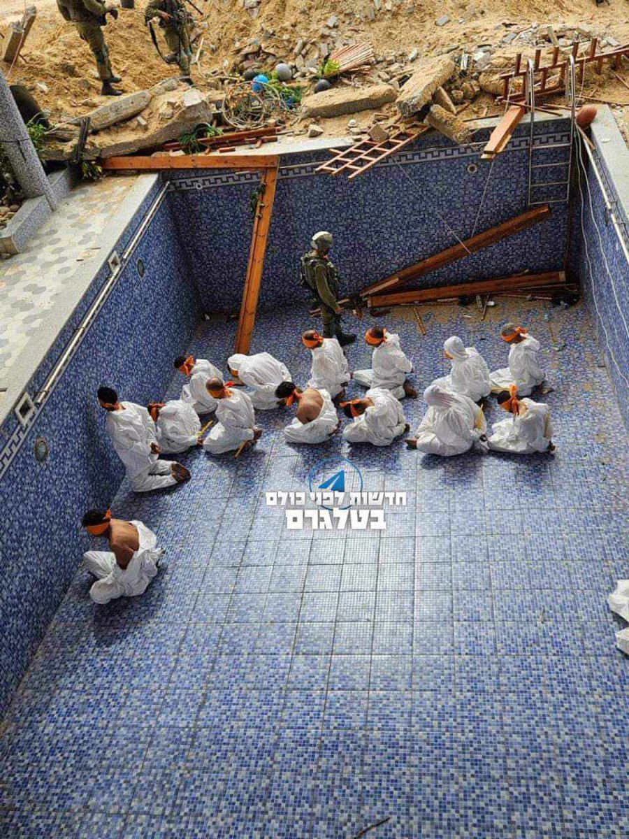 Israel's military kidnaps civilians from Hamad City in Khan Yunis, Gaza and holds them inside a pool.