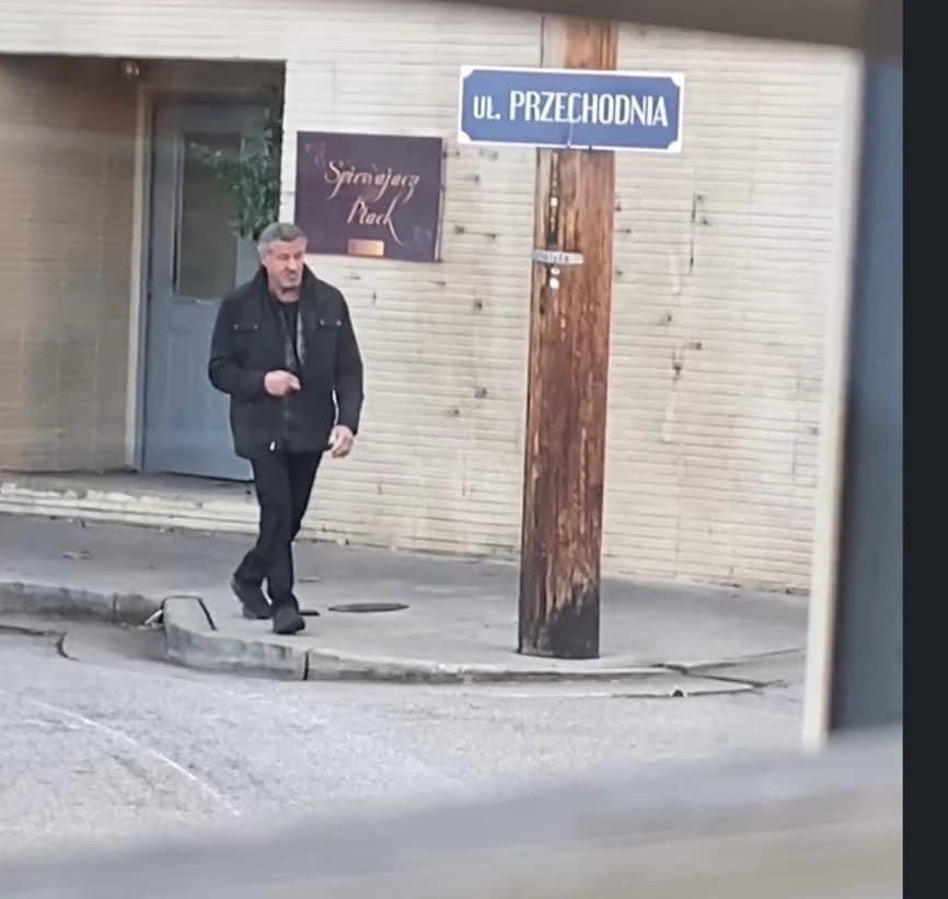 jeff_lanenews's tweet photo. Production has wrapped on Sylvester Stallone's new movie, which was shot in Hueston Woods and in Oxford over the last couple of weeks.  Here's Stallone walking near the entrance to O-Pub in uptown Oxford with street signs that were changed out for the movie shoot. https://t.co/YsN1h8t7KF