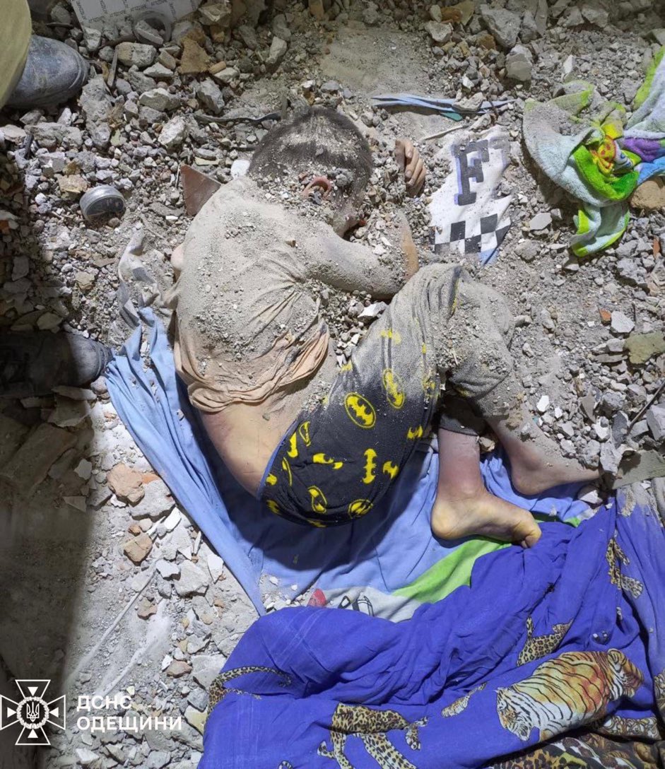 Look at his Batman pyjamas. 
Look at how he’s cowering from the impact, trying in vain to protect himself.

This could be my son. 
This could be your son. 

This is what our leaders allow to happen by not giving Ukraine what it needs to win 
- &amp; what their weakness invite on us.