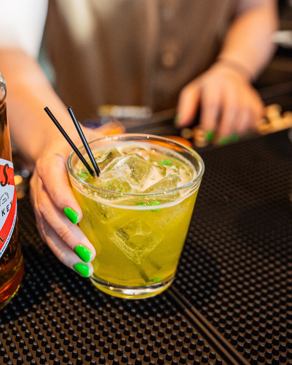 Raise your glass to St. Patrick's Day with our lucky Irish Spring cocktail! Crafted with Power’s Irish Whiskey, Midori, grapefruit juice, and a splash of Grand Marnier, its green hue and candy shamrock garnish will have you feeling the luck of the Irish. ☘️