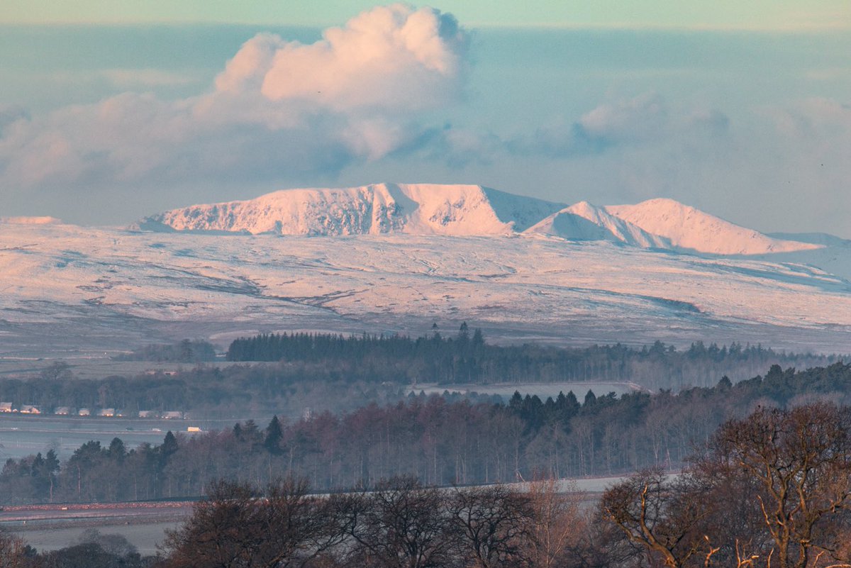 Helvellyn as seen from near home today at sunrise 🌅⛰️❄️ Looking a bit brighter compared to my previous image in another post (X..Tweet or whatever it’s called nowadays!). Ya can see how cold it was this morning as the sun rose #lakedistrict #helvellyn #ukweather