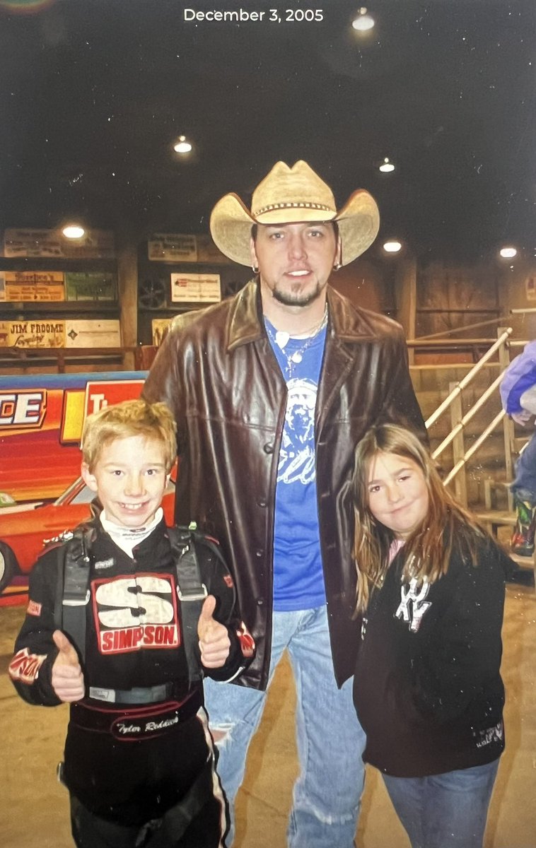 The photo was taken 12/3/05 at Red Bluff Outlaws kart race in the Pauline Davis Pavillion. A young <a href="/Jason_Aldean/">Jason Aldean</a>, with Broken Bow Records (which was owned by Tyler’s grandpa Benny Brown, who also sponsored Kyle) was there to sing the national anthem.