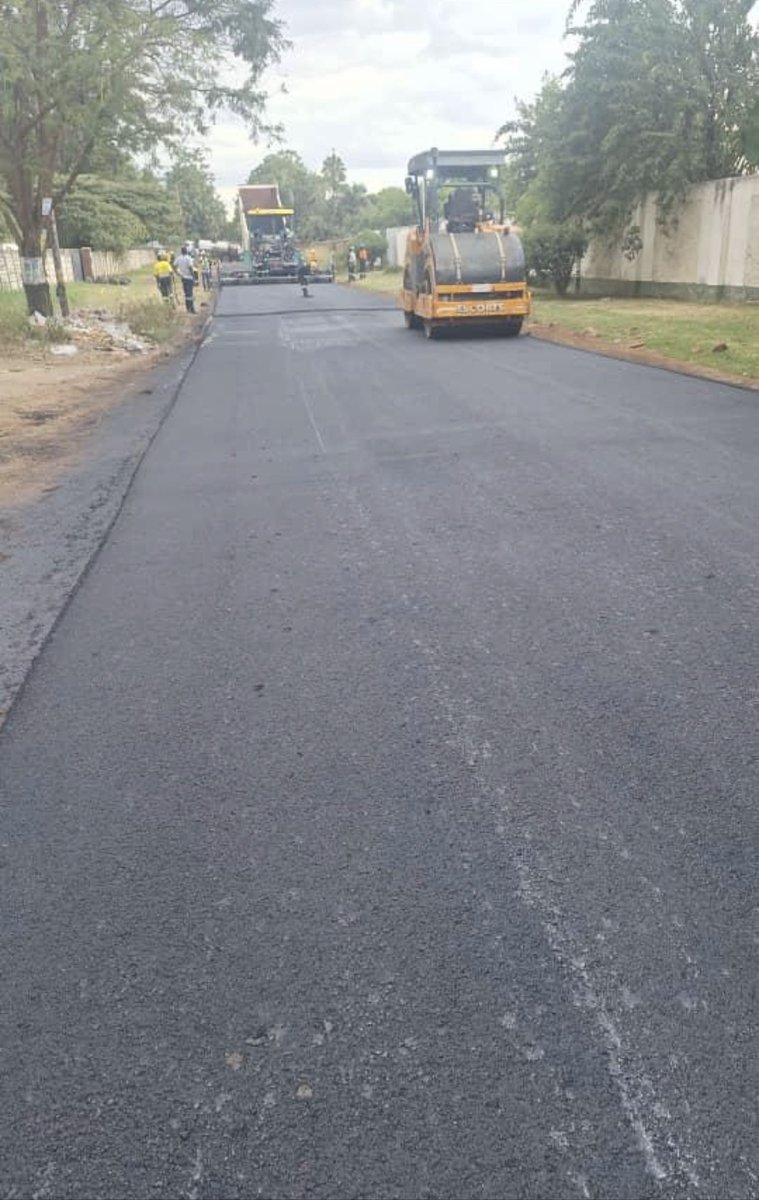 Application of Asphalt on East Road Rehabilitation Project . East Road is parallel Sam Nujoma (Formerly Second Street)