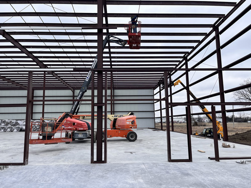 With warmer weather come windy days, a natural enemy when putting on metal wall or roof panels, &amp; we have a lot of both on this project. Despite this, progress is taking place at the Hasty Awards project. Randy Frahm, jobsite superintendent, is busy managing many activities!