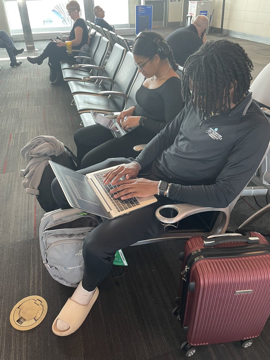 Had to take this pic.. we’re flying out to nationals, and once we got to our gate, these two bust out their laptops and began schoolwork. 
Scholar-athletes at work here!
#proudcoach