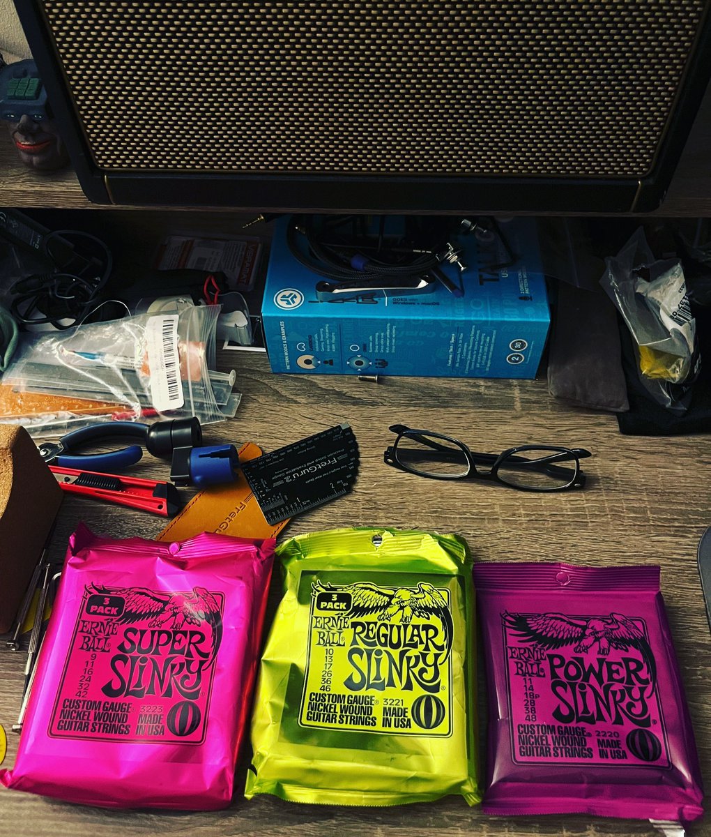 Guitar workbench decisions. I’m now a 11 gauge fan on short scales, and 10 gauge fan on full scales. What’s your favorite string gauge? #guitar #strings #ernieball #slinkys #luthier #setup #musician #guitarplayer #composer