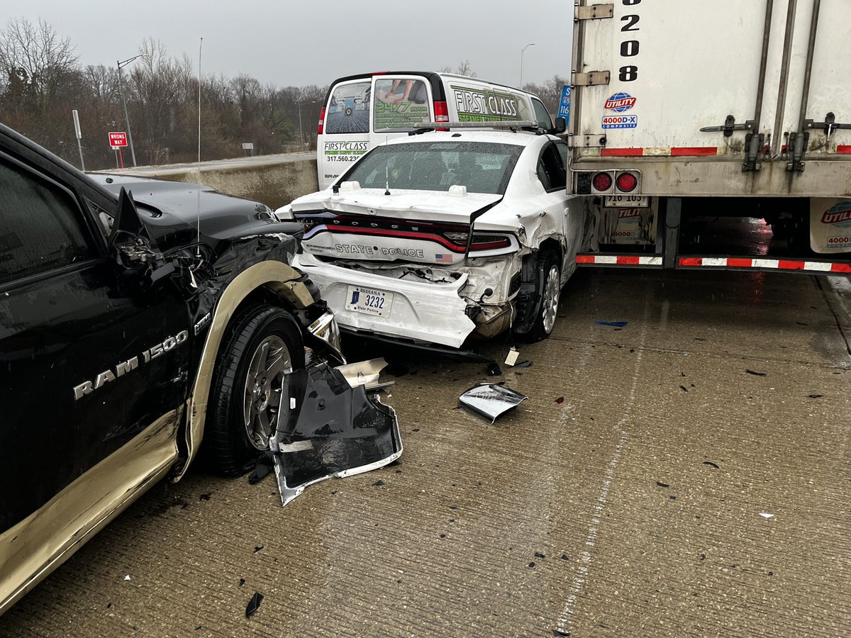 Two Indiana State Troopers were inside this ISP car investigating a previous crash at this location when a semi crashed into them on I-65 southbound south of 38th Street in Indianapolis Both troopers are being transported to hospital with non-life threatening injuries