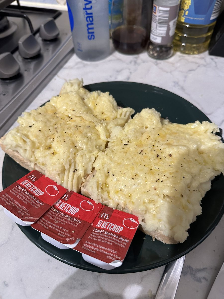 Had a tooth out- so I’ve got pomme purée on artisanal loaf, topped with melted aged cheddar and served with a tomato reduction 🥰 (it’s smash on toast with melted cheese and ketchup) 😂