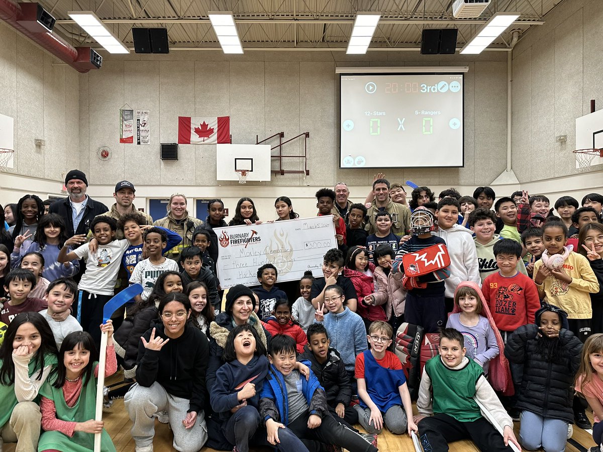 Local 323 Burnaby Firefighters Engine 2 crew stopping by Morley Elementary and donating money to their floor hockey program. #burnaby #cityofburnaby