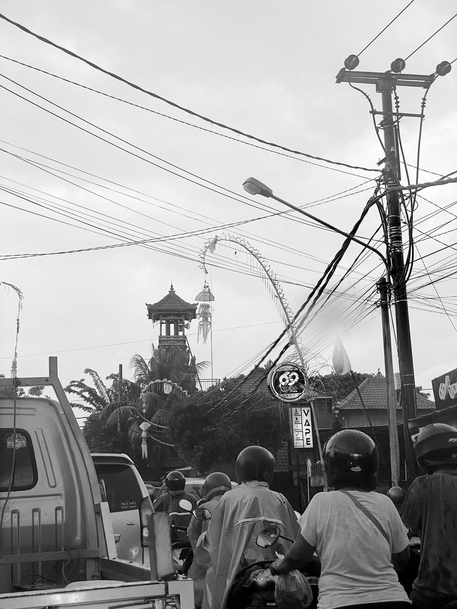 Culture and modern life … the temple and the motor bikes and power lines… contrast