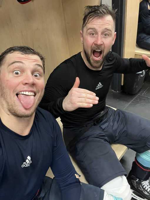 Burky taking a selfie Tatar in locker room after big win