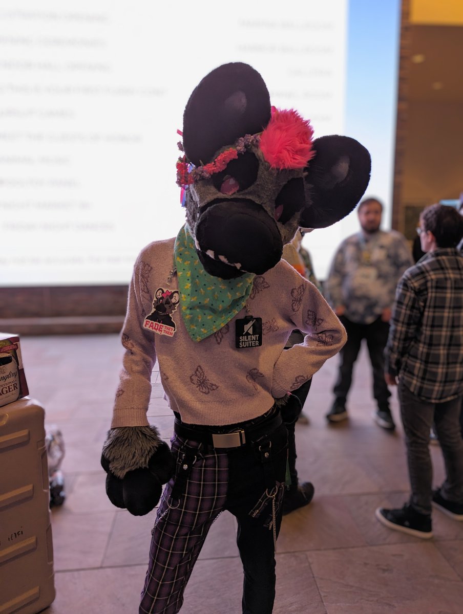 I may look like I'm being sassy in this photo, but I'm actually just waiting for my eyesight to return after accidentally looking at the bright screen behind me (I love the screen tho, great to see furries on the big screen~)

#FursuitFriday #ANE2024 
📸: <a href="/DeerOfTurquoise/">Turquoise Deer @...somewhere</a>
