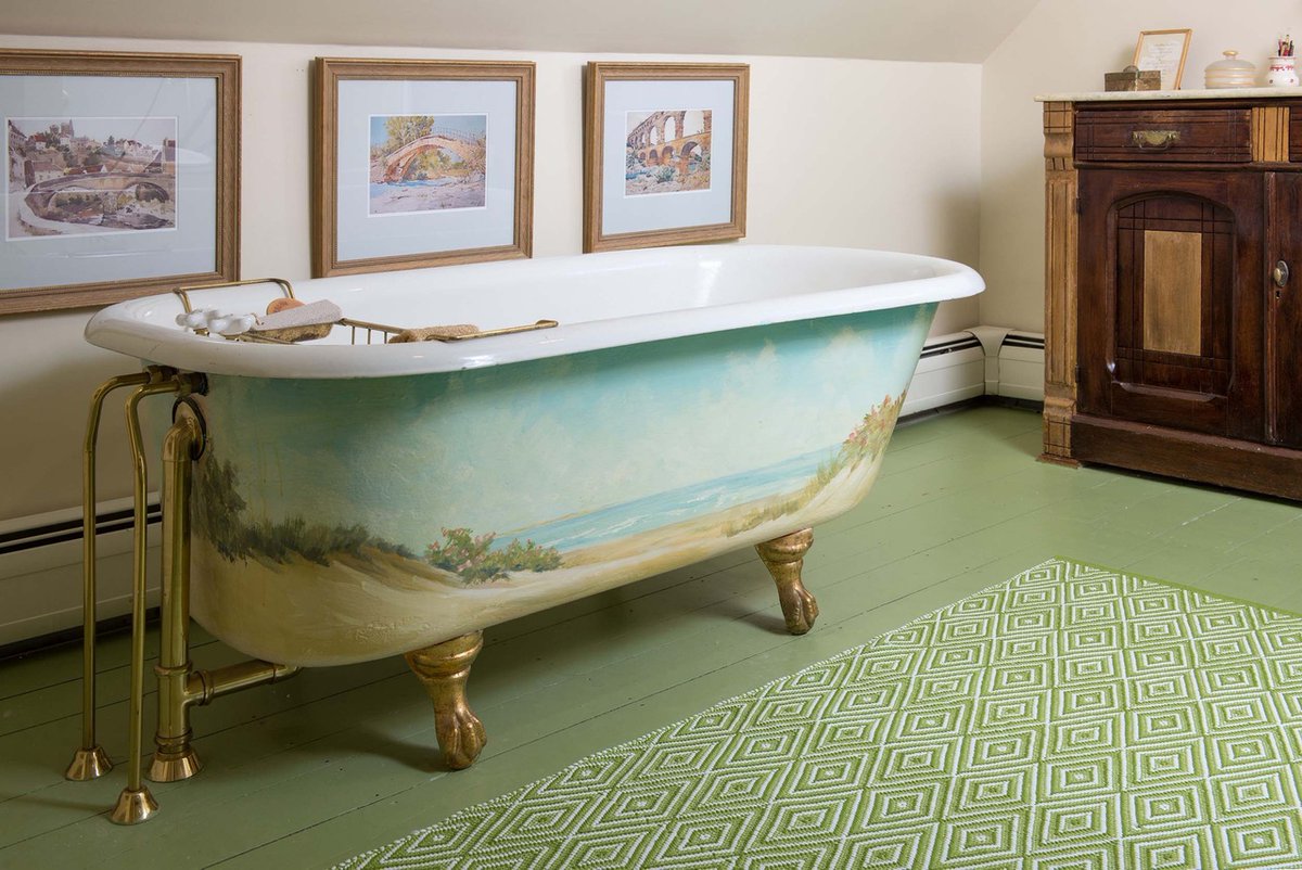 What a treat to design this bath for my clients' classic New England home. The wood floors, which we painted green, and antique furnishings are so fitting for the space. Everything feels exactly as it should.