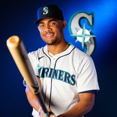 Photo of Julio Rodríguez holding a bat during photo day.