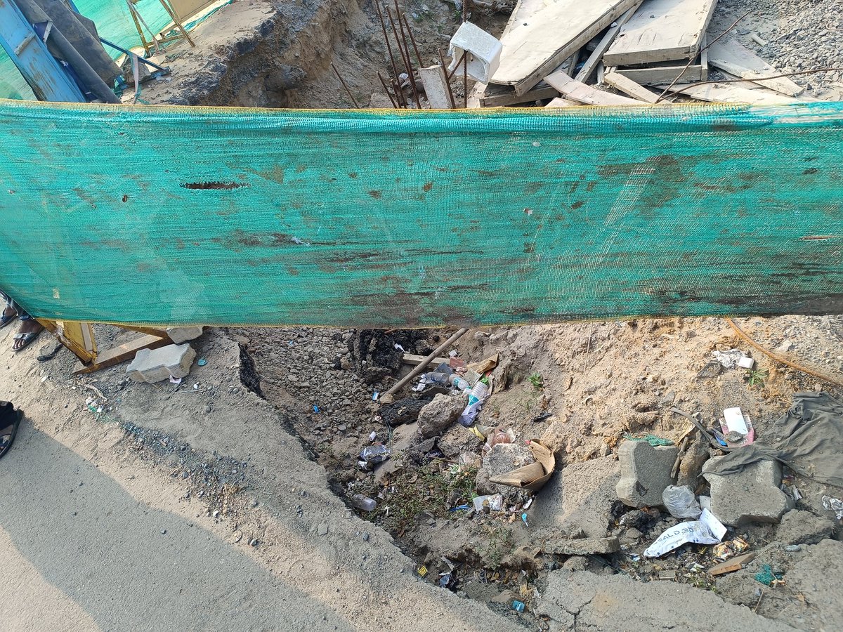 sent_hil's tweet photo. @chennaicorp Road continuously caving in near the open pit dug for rain water drain construction and left open. Passengers waiting for city bus are slipping and getting hurt. Location:  Thoraipakkam, opposite BSR Mall, in front of Mandarin Apartment. https://t.co/DhAfJB9fBo