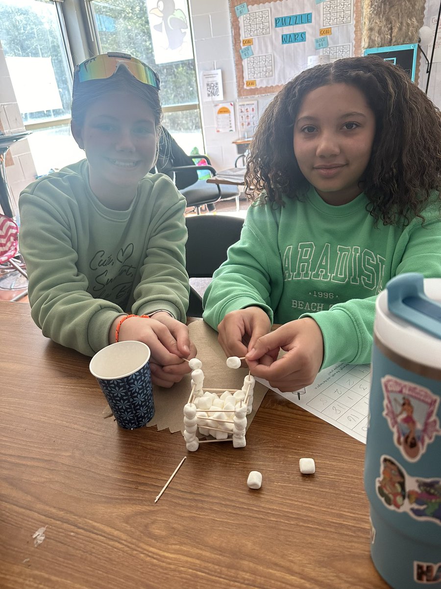 Ms. Halls huskies were applying those skills we reviewed the other day on Volume with MARSHMALLOWS! That got some head turns today 🖤 They were able to build a prism and identify all the parts to calculate the volume. Keepin those previously taught standards freshhhh! #CPSbest