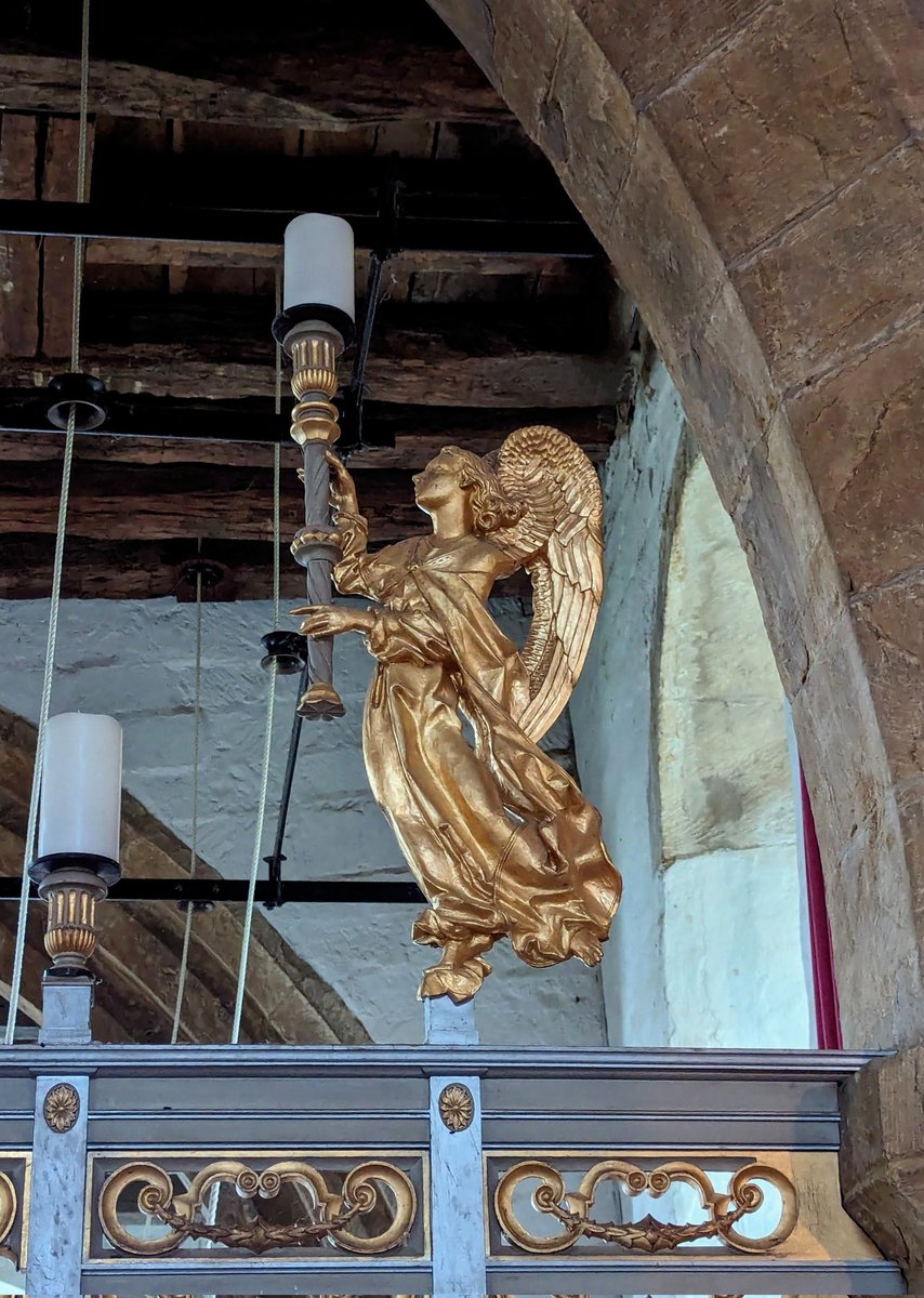 A golden angel, her draperies rippling in the breeze holds a candle on the screen at St Etheldreda, Horley.
Designed by T. Lawrence Dale 1947-50. 
He was the Oxford Diocesan surveyor from the 1930s and designed churches himself as well as restoration.
#ScreenSaturday