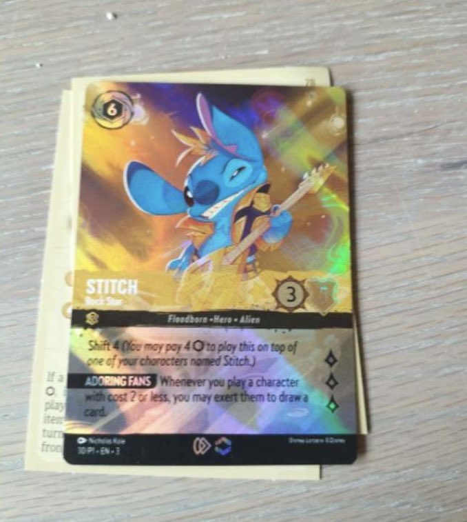 Soooo apparently you can pull enchanted stitch rockstar from your #Lorcana  Into the Inklands booster packs??