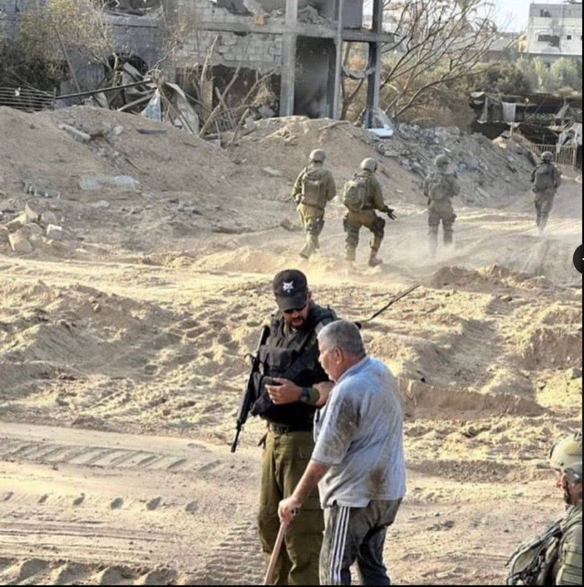 A photo of soldiers helping an elderly Palestinian man in Gaza was posted by Israeli forces.

They shot him in the back twice and killed him after filming.