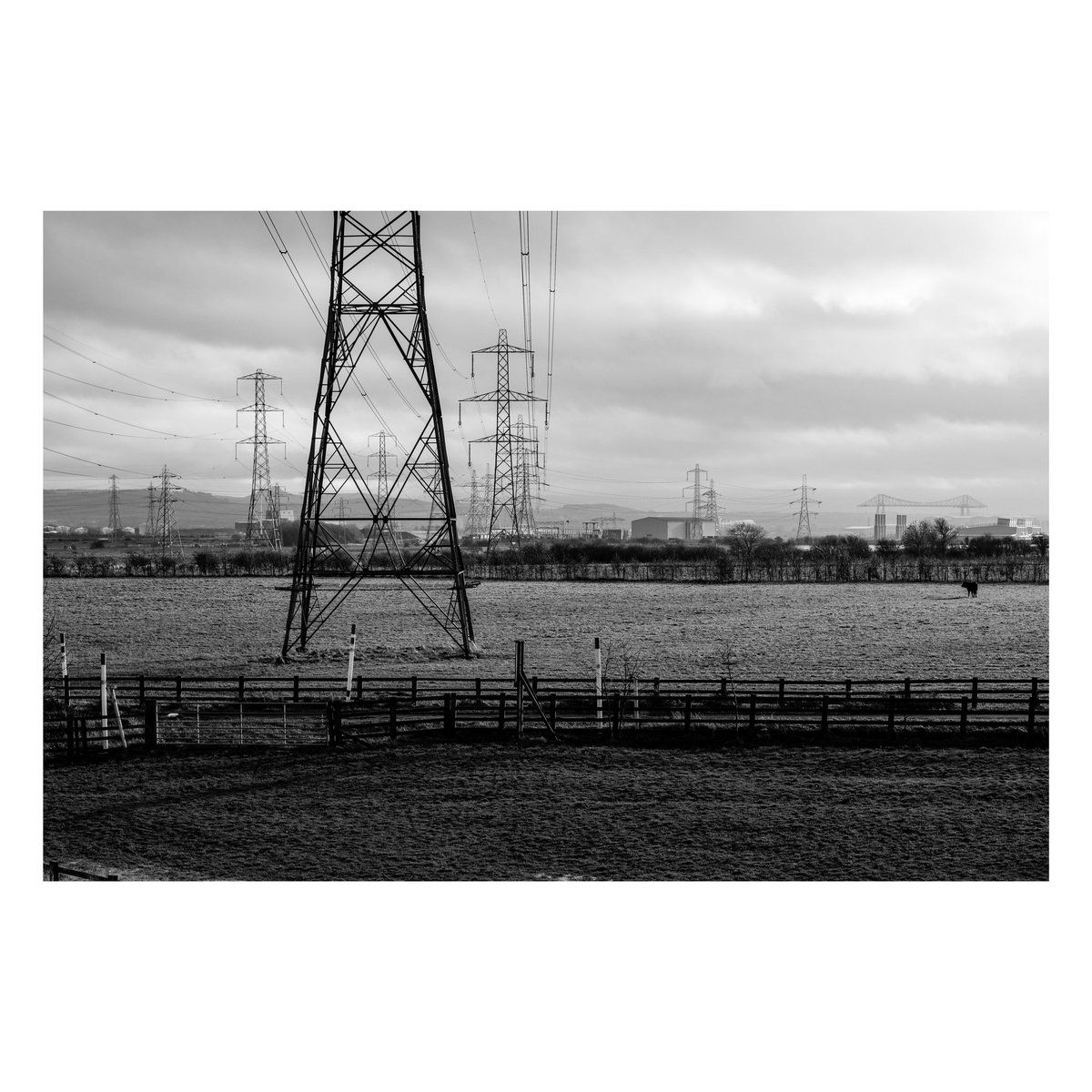#pylons view towards #Middlesbrough #teestransporterbridge can just about be made out. #northeast #england #blackandwhitephotography #landscapephotography #bnwphotography #hartlepool