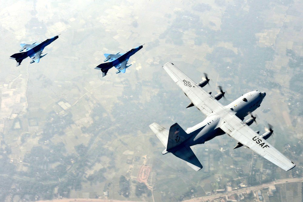 Defres360's tweet photo. When exercise cope south was a true military Exercise:-

Two Bangladesh air force F-7BG Defenders, a C-130B Hercules, and two U.S. Air Force C-130H Hercules aircraft prepare to take off from BAF Base Bangabandhu, Bangladesh, during Exercise Cope South. https://t.co/S3Vnh1PusO