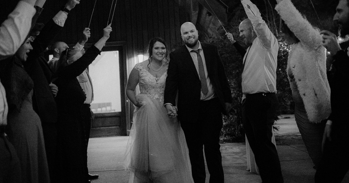 This might be one of my personal favorites to this day... Is it fancy and flashy? No. Is it dark and kind of grainy? Yes. But does it evict emotions? For me, yes... Being there and seeing the pure joy that the guests had for the Bride and Groom was moving...