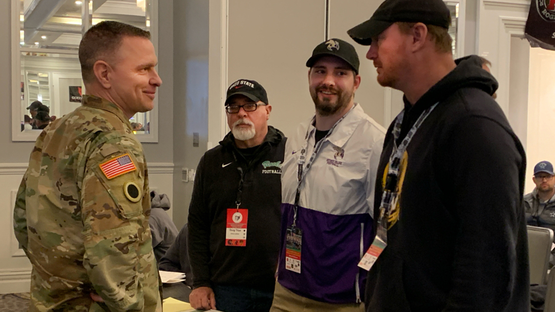 BG Matt Woodruff spoke to over 2,000 high school football coaches about 'Developing Leaders' at the @ohsfca Clinic last week. He was introduced to the stage by OSU Head Football Coach Ryan Day, and awarded the Buckeyes coach with his Challenge Coin. #NationalGuard @ryandaytime