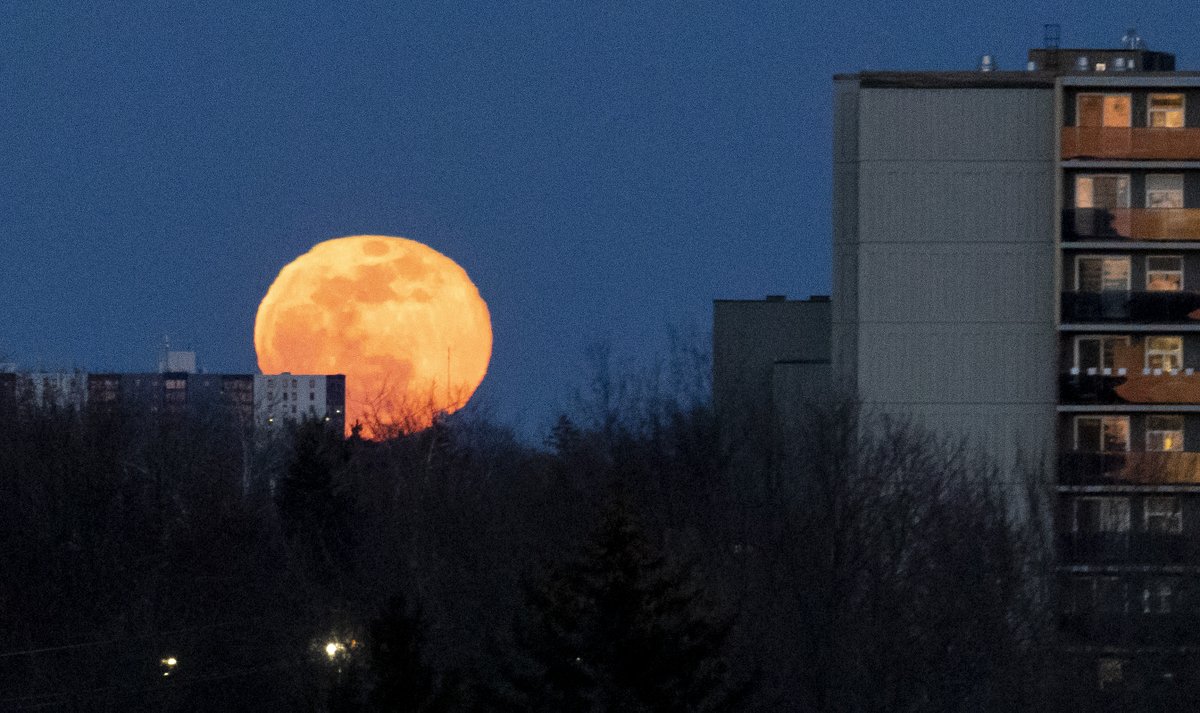 Nearly full moon rises in London Saturday night.