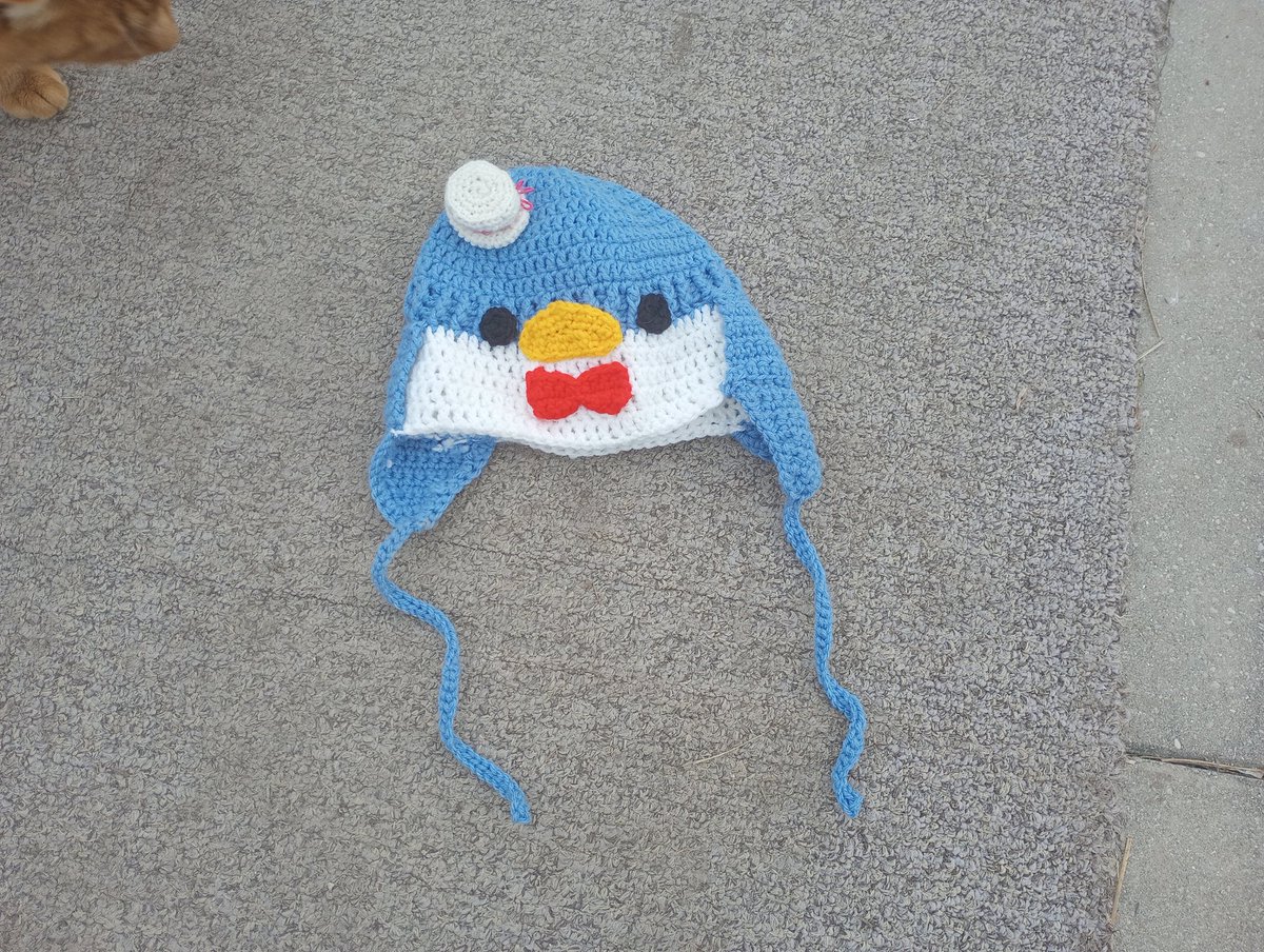 Briannahake23's tweet photo. This is my newest crochet hat I made!  It is Tuxedo Sam from Hello Kitty!  There is no written pattern I made it up myself.  #crochet #hat https://t.co/frRJa8QNps