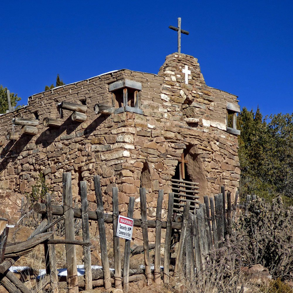 Built on a rock outcropping above Cerro Gordo Road in #SantaFe, La Capilla de San Ysidro Labrador honors San Isidro Labrador, the eleventh-century patron saint of farmers. The chapel was built by Lorenzo López in 1928, using stones from his property and mud from the acequia.