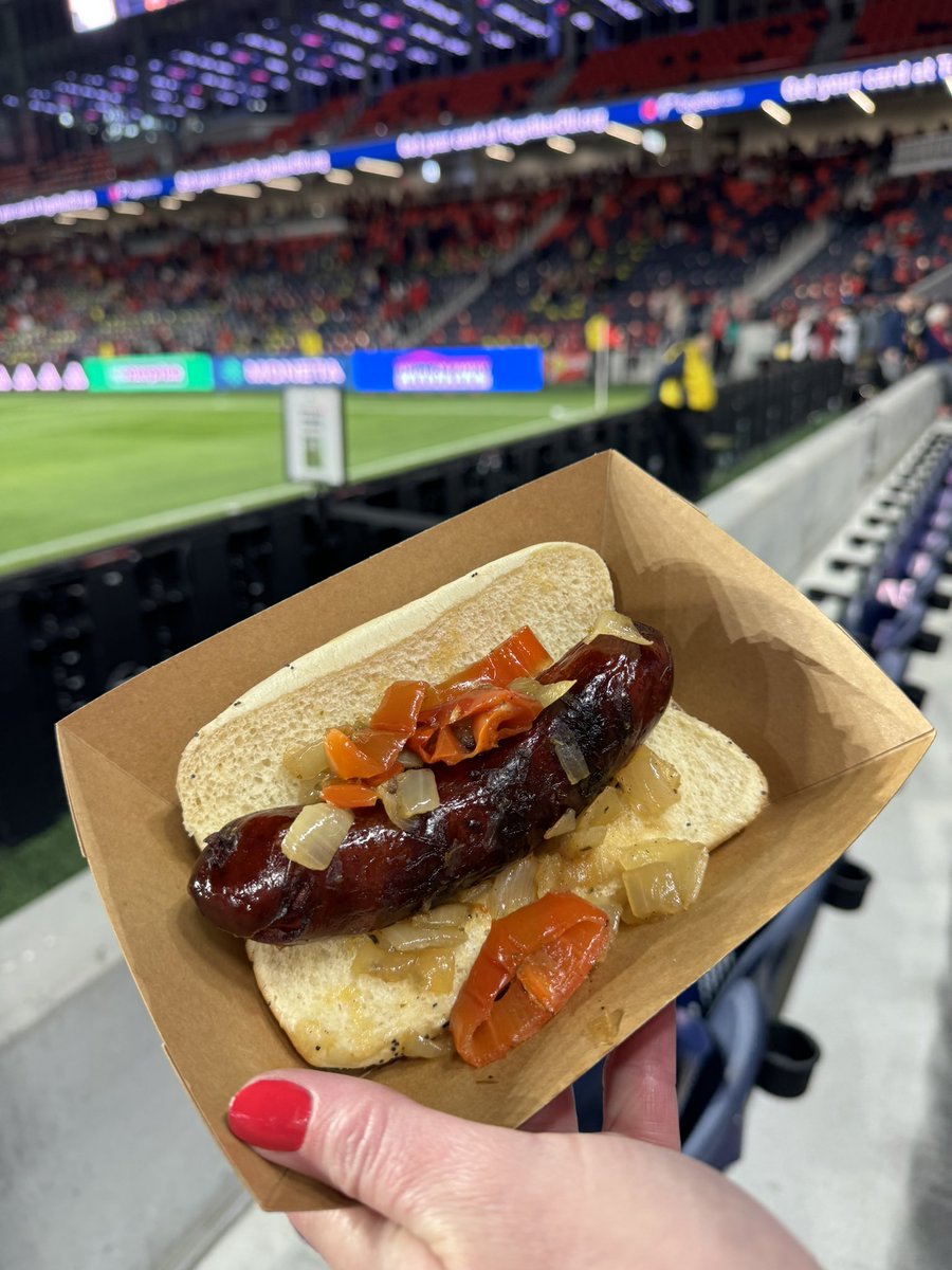 Loaded Duck Dog: Perrenial grilled duck dog on a poppyseed bun topped with Mama Lils’ peppers and grilled onions. $13.99 @oliveandoakstl #scran #footyscran #scranlouis #mlsscran #stlfood #allforcity #allforscran