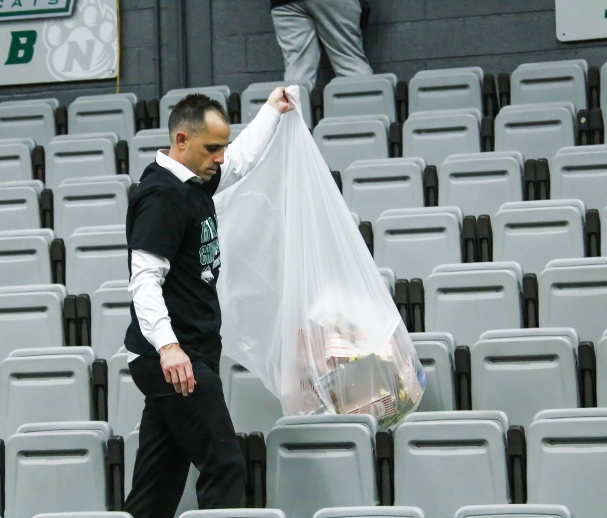 Just moments after winning his 11th-straight MIAA regular season title, coach Ben McCollum took it upon himself to help clean up the stands in Bearcat Arena.