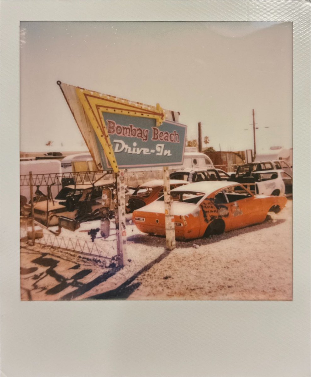 InstallationMag's tweet image. Day 54 / 366 🧡A treasured archival photo comes from a visit to the Salton Sea, specifically during the #BombayBeachBiennale. I happened upon a drive-in where auto bodies slipped into a beautiful decay and their mechanical components ⚙️⏳dissolved into the memory of the sand. I…