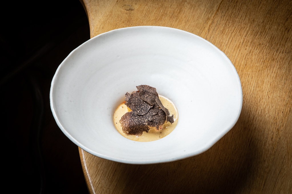 For the scallop course, the team serve a sabayon sauce table side, blending the richness of brown butter and the depth of black squash tamari. This course is completed with shavings of black winter truffle.