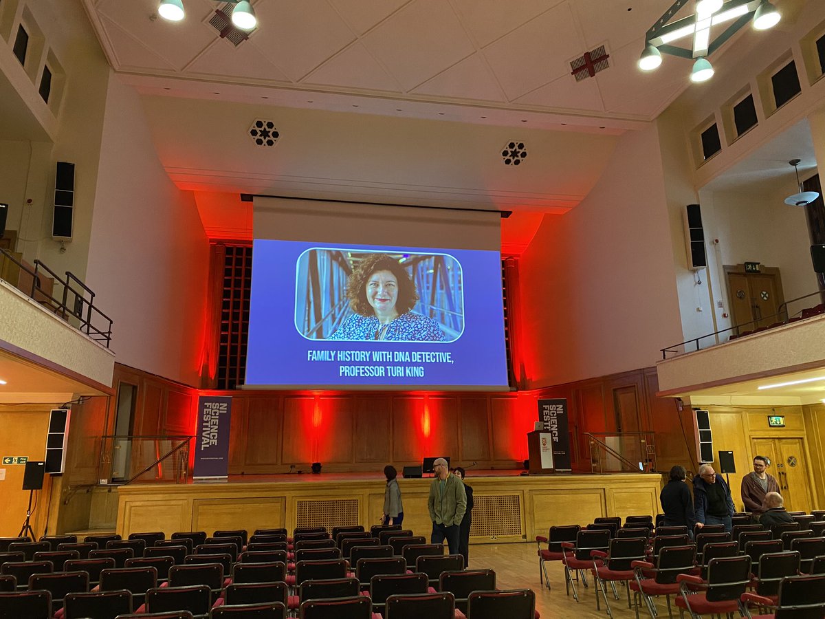 Turi__King's tweet photo. A lovely quick hop over to #Belfast this afternoon to speak at @QUBelfast for the @niscifest! Such a great time!  I got to say hi to @gordonjbuchanan (very briefly!😂) and @MarcusduSautoy, who gave a fab talk! And finally met @cbgenealogy. 😊
Highlight was definitely meeting up with #DNAFamilySecrets alumni @clareadair and Peter! 😍🥰 They send their love to #StaceyDooley!
Meanwhile loving the badge: I mean who doesn’t want a scientifically-inclined dinosaur on a badge! 🦖🥼
@Minnow_Films 
@keviclifton 
@UniofBath 
@JoSarsby