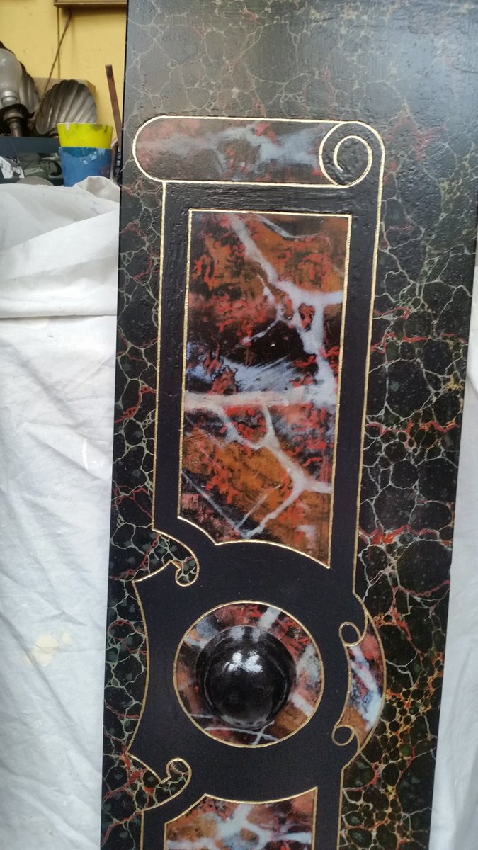 Restoration of Hand painted marbling  on a Slate Fireplace  surround .