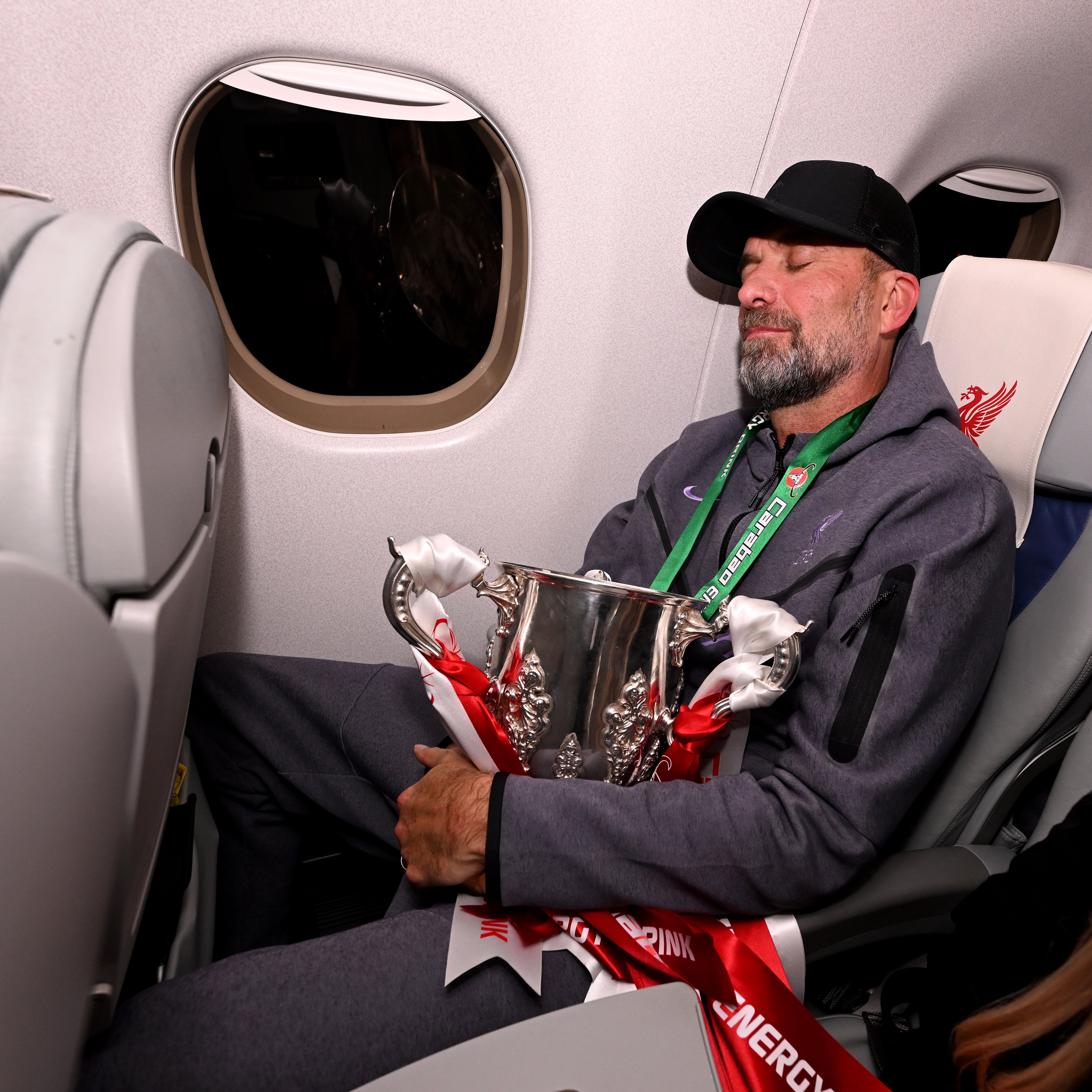 Jürgen Klopp holding the Carabao Cup on the Reds flight back from London. 