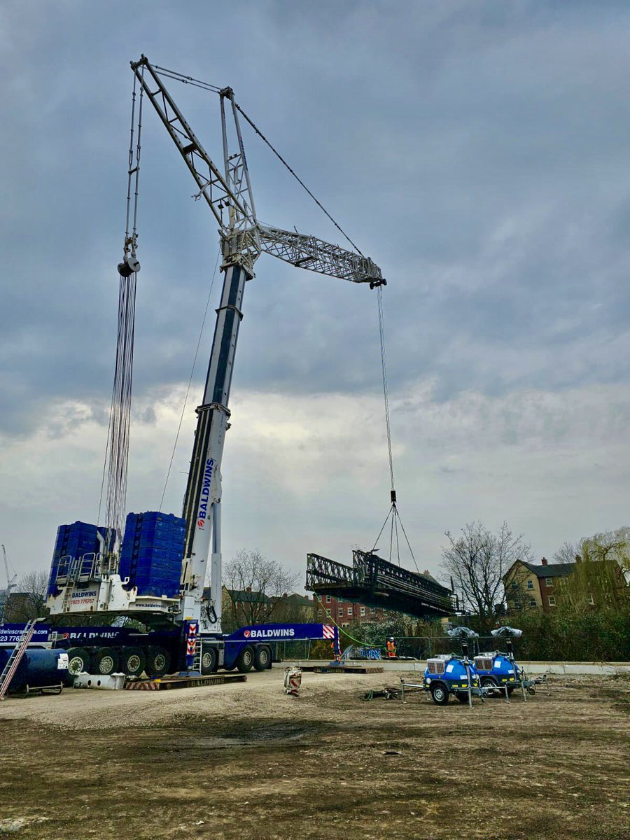 Terex Demag AC1000 using its luffer in Central Leeds, West Yorkshire