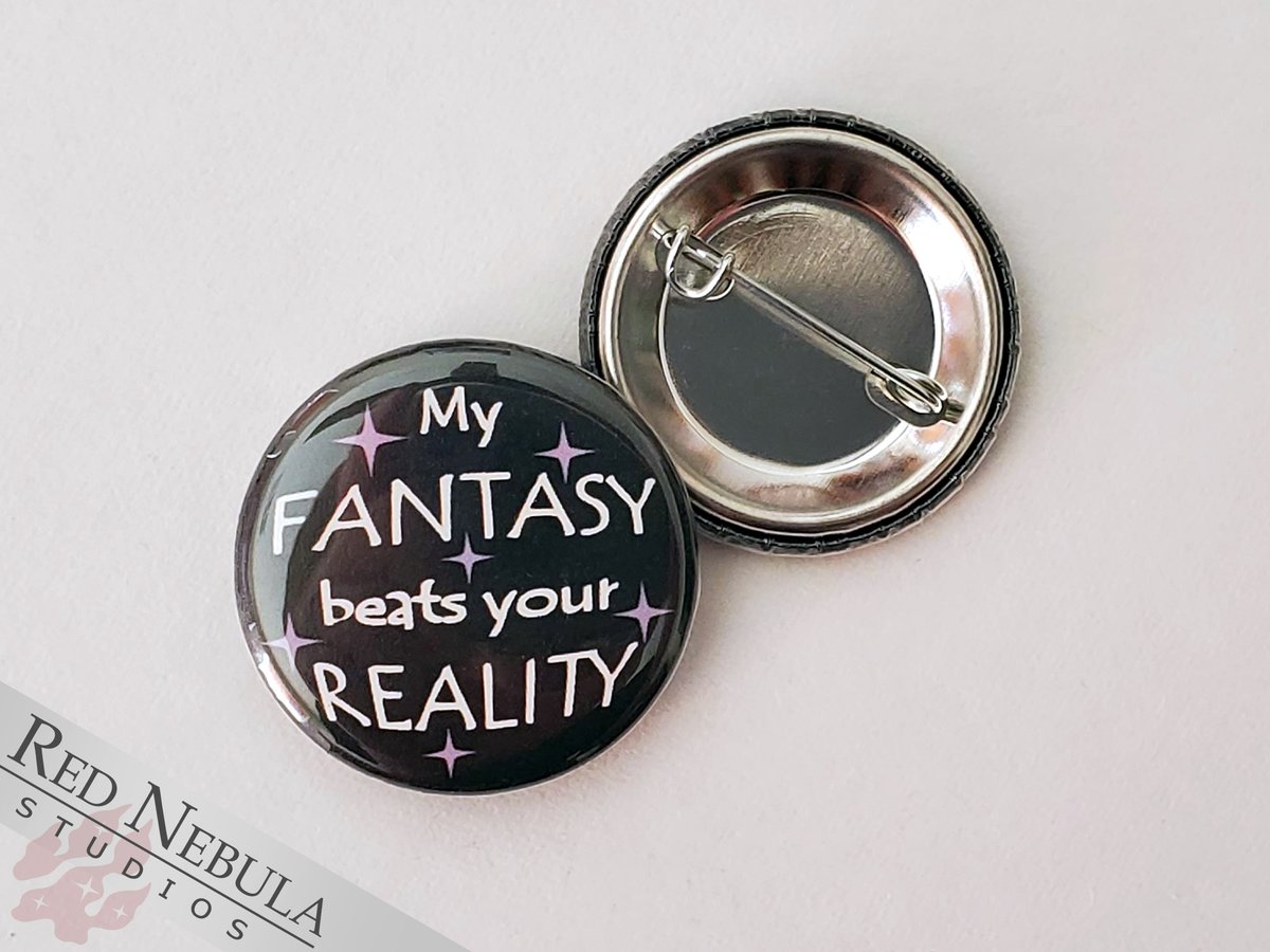 My fantasy beats your reality button, available in pinback and keychain. - Robbie.